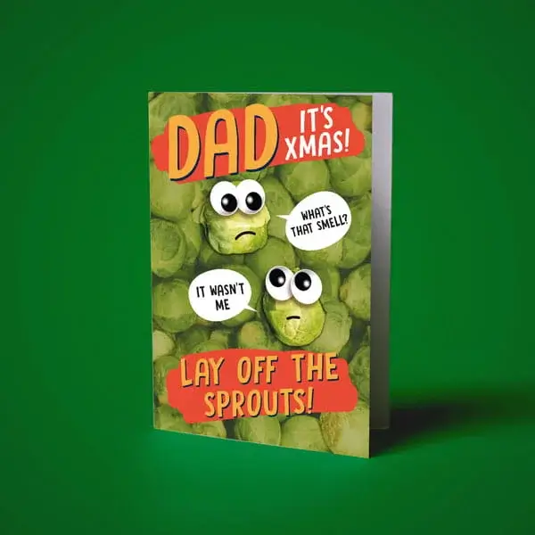 Humorous Christmas card featuring illustrated Brussels sprouts with cartoon eyes and festive typography on a green background.